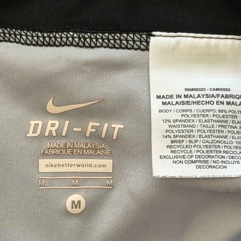 Nike women's running shorts in a gray and black geometric pattern. medium